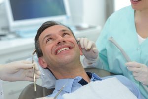 man happy in dental chair